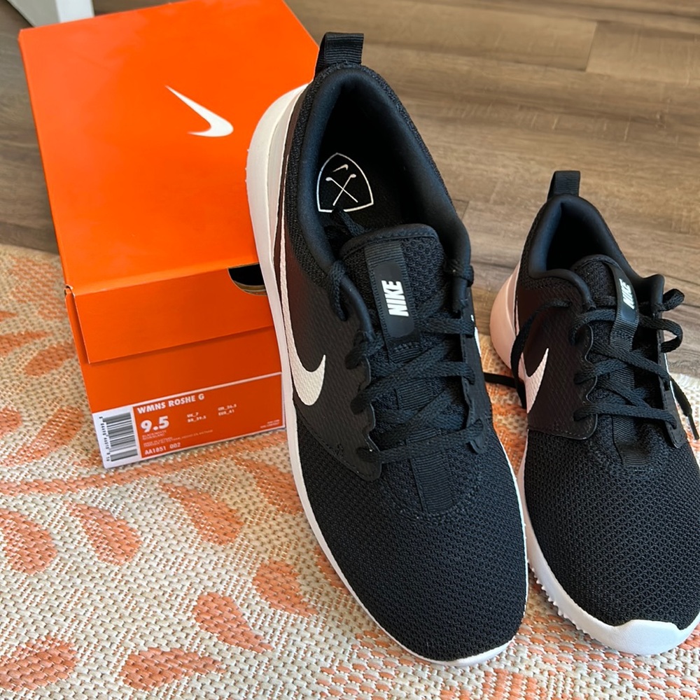 Black, never worn women’s Nike golf shoes. Still in original box…size 9.5